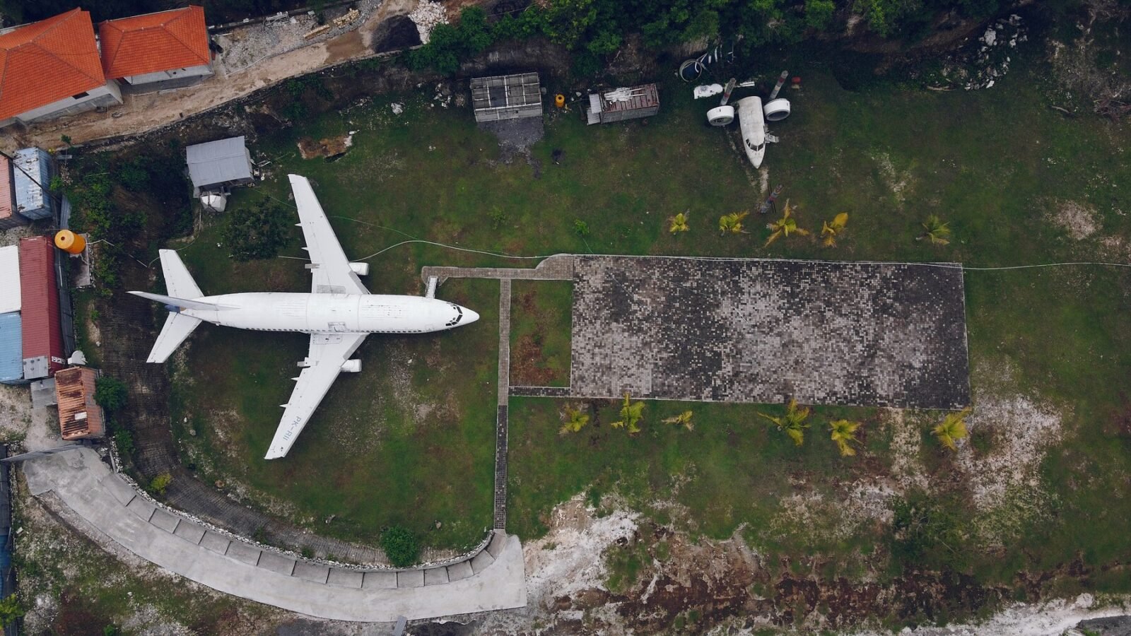 Aerial view of a luxury home, showcasing property features from above.