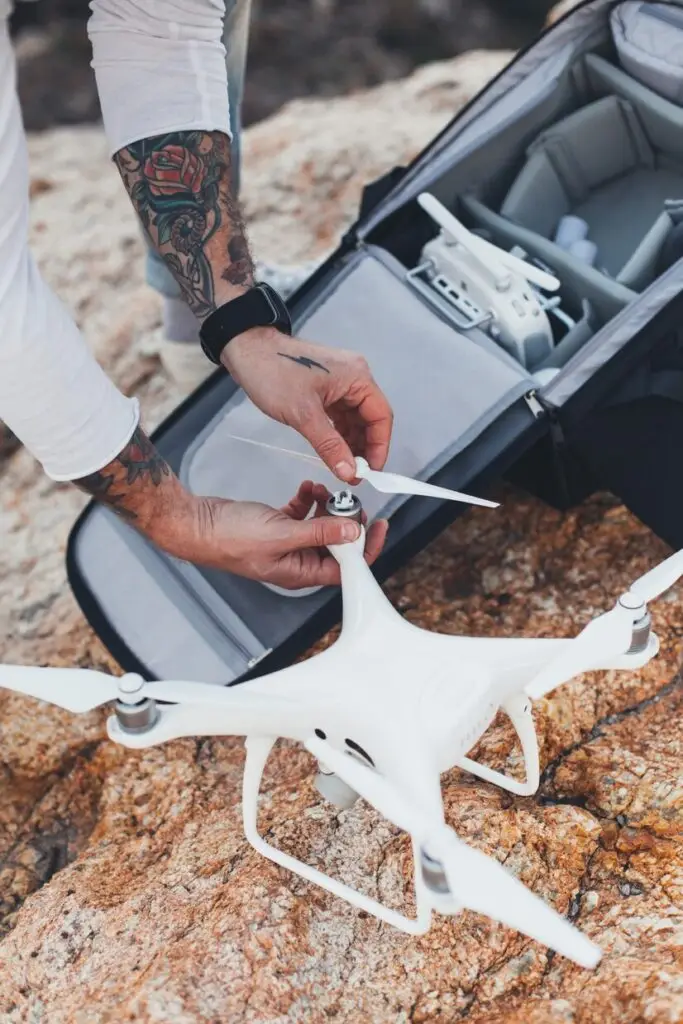 Person unpacking a drone from its case during training session